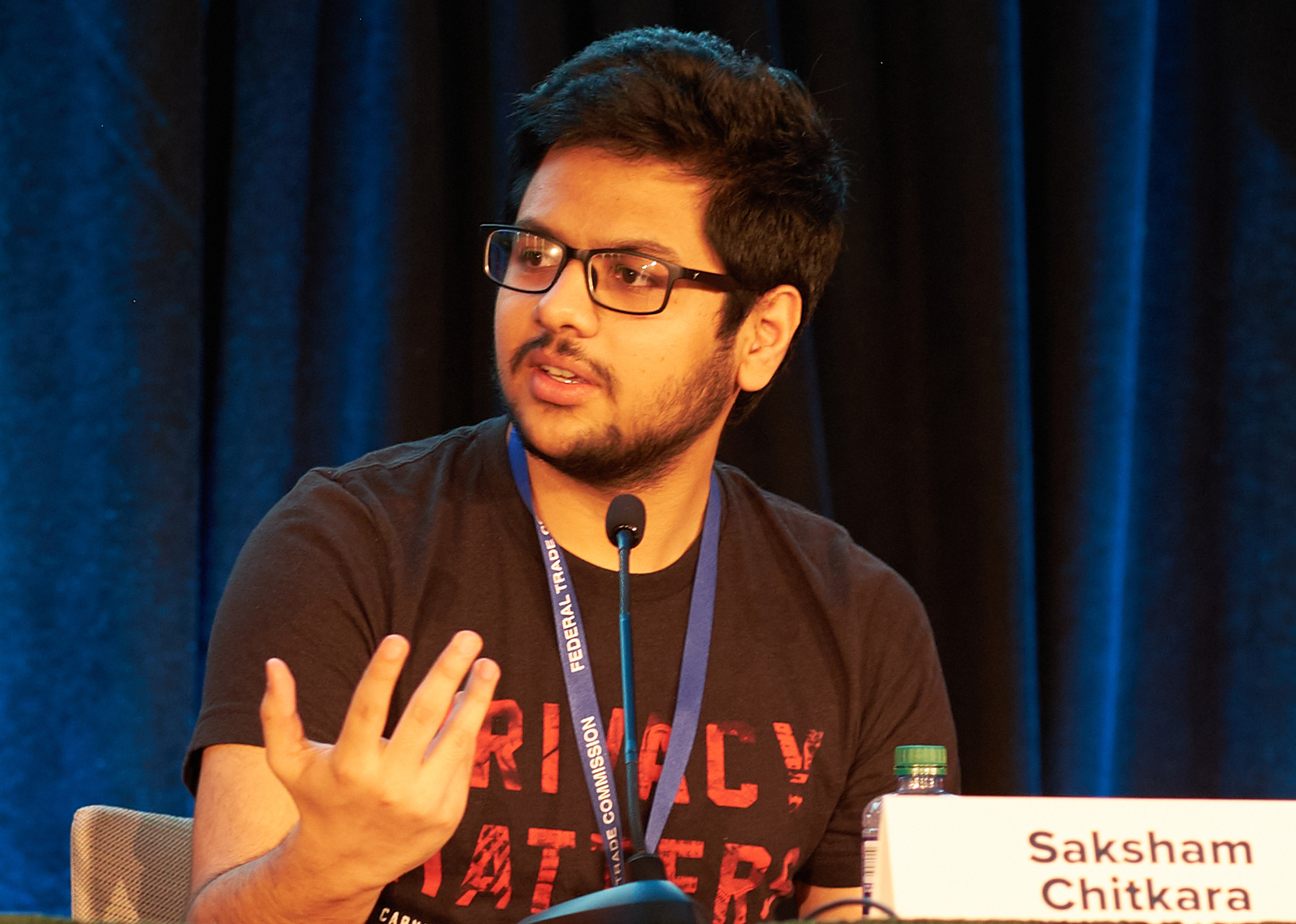 Man speaking on a panel