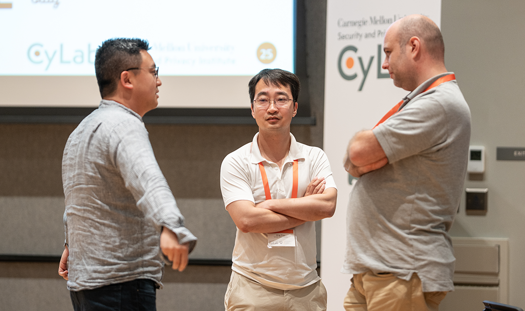 Photo of individuals talking at a CyLab networking event
