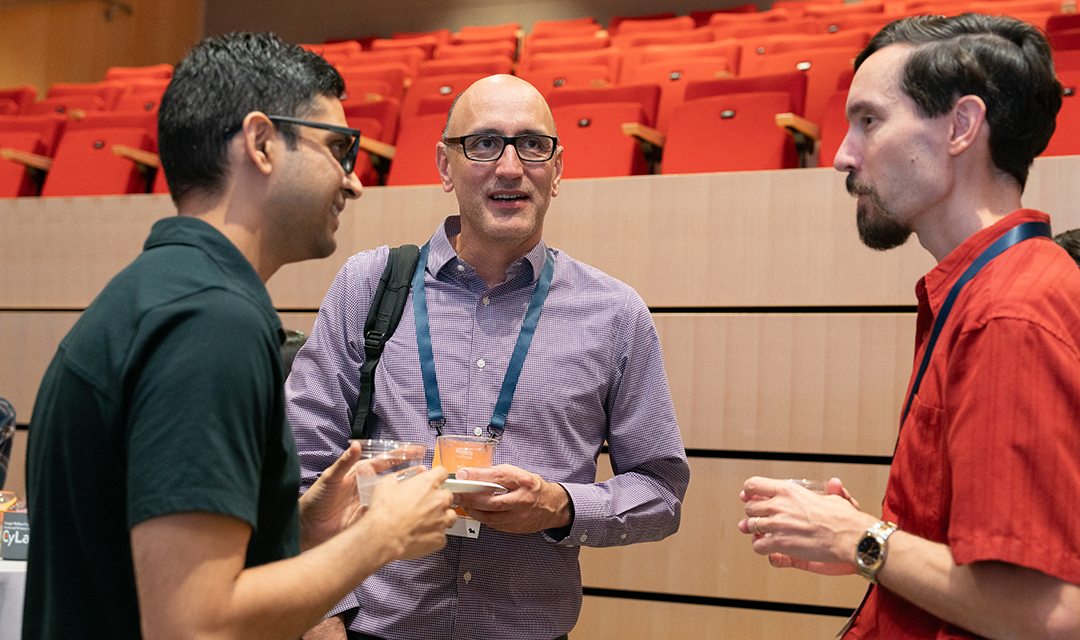 Photo of individuals talking at a CyLab networking event