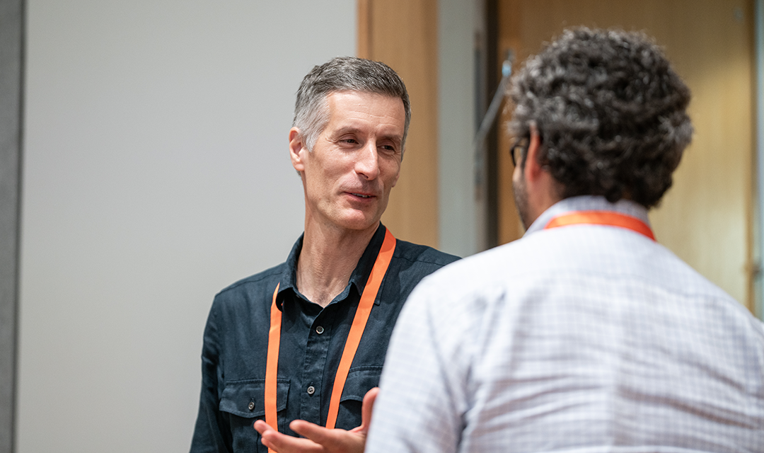 Photo of individuals talking at a CyLab networking event