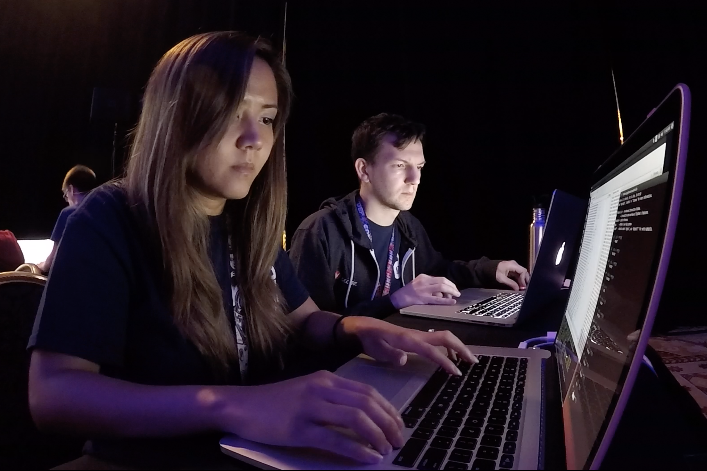 Two students in front of laptops