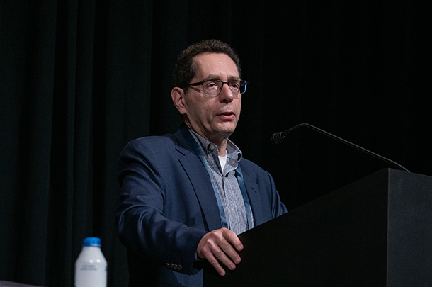 Photo of Norman Sadeh speaking at a podium