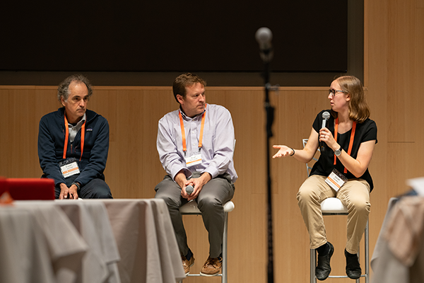 Photo of Sarah Scheffler speaking to Ariel Zetlin-Jones during a panel at the CyLab Partners Conference