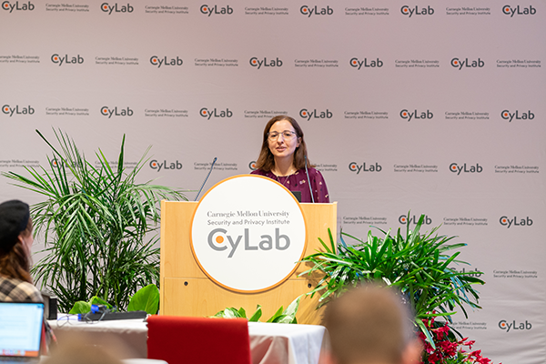 Photo of Alina Oprea speaking at the CyLab Partners Conference