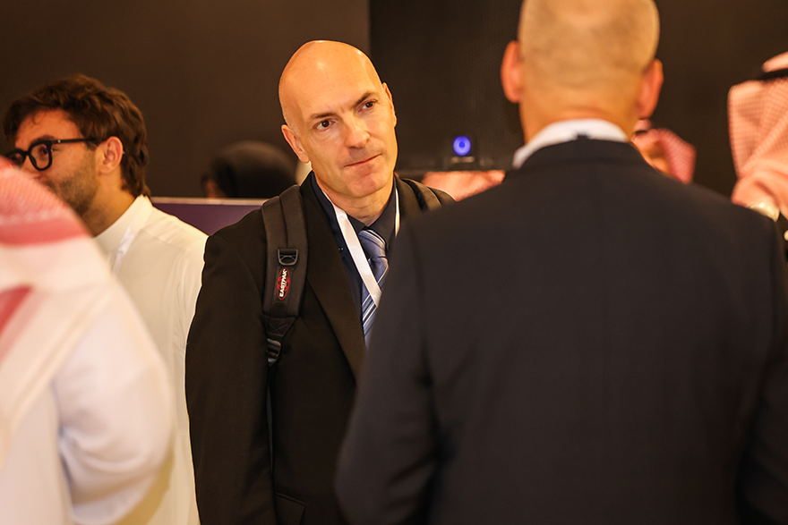 Photo of Nicolas Christin having a conversation at the 2025 Global Cybersecurity Forum Carnegie Mellon University Alumni event