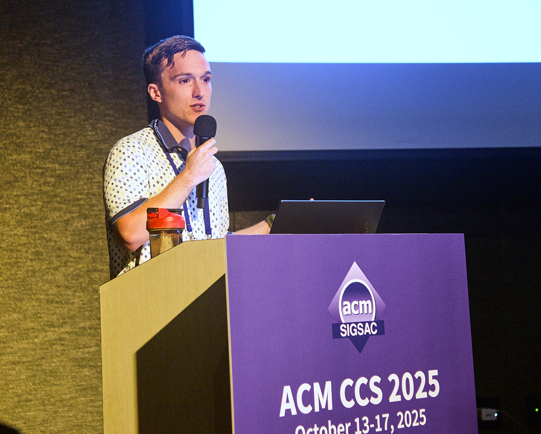 Photo of Elijah Bouma-Sims presenting his research at the 2025 ACM-CCS Conference