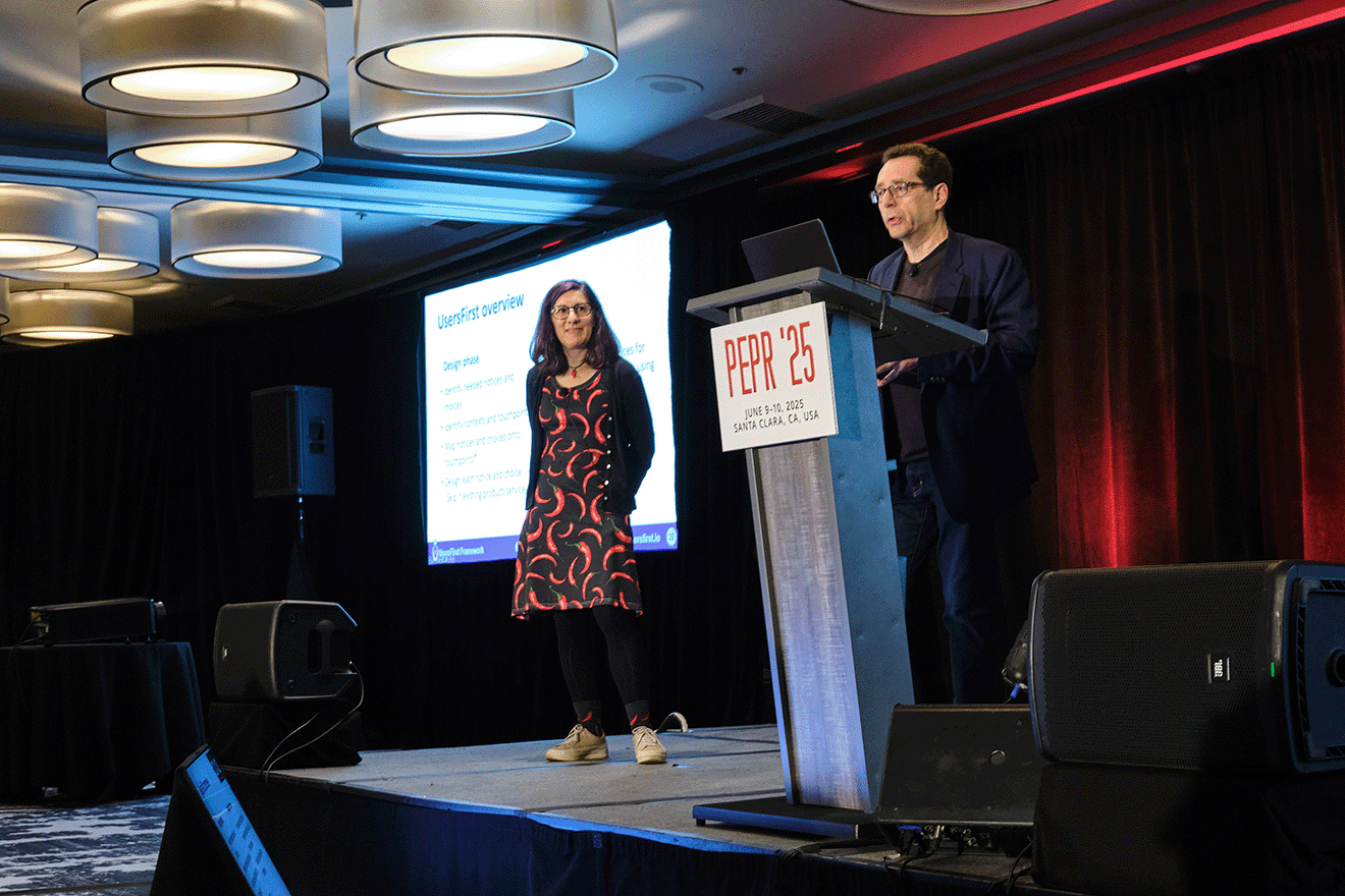 Photo of Lorrie Cranor and Norman Sadeh presenting research at PEPR 2025