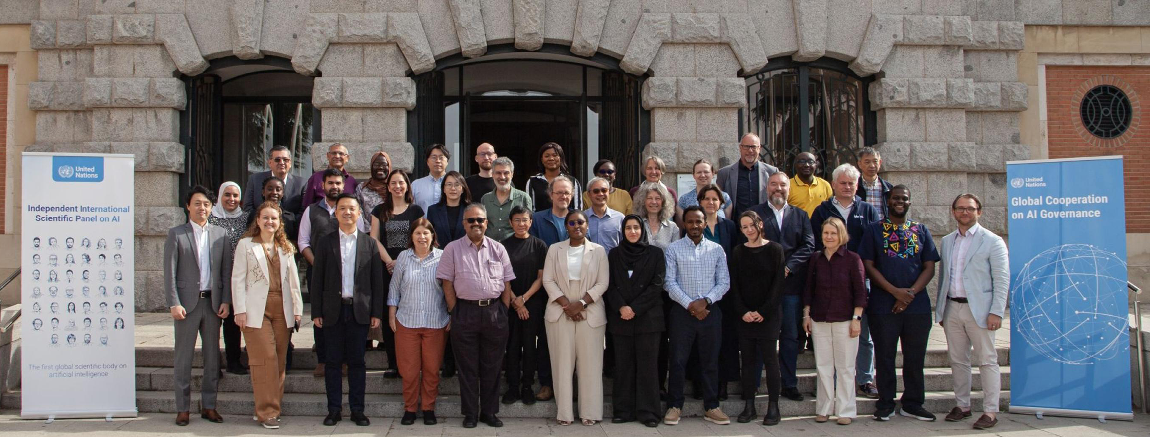 Posed group photo of participants in the UN’s first Independent International Scientific Panel on AI.